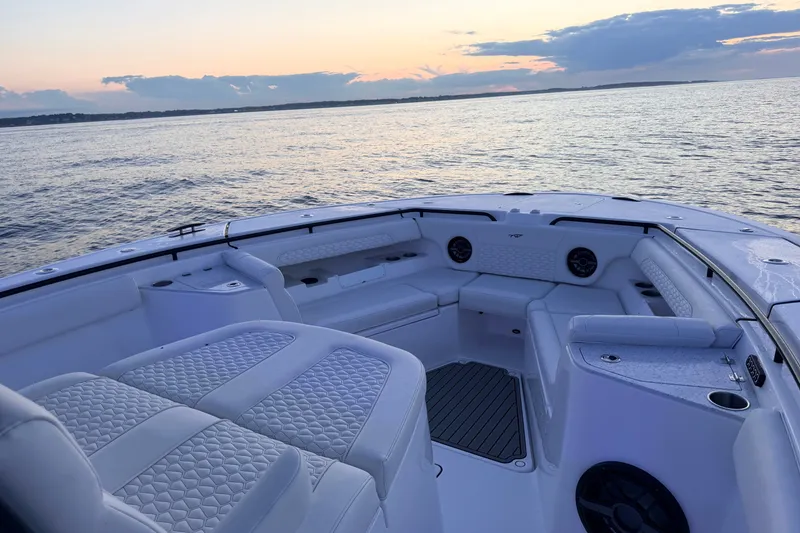 Slide: The Image of Luxurious interior of 2027 Tidewater 330 CC Adventure boat at sunset on the water. - 25