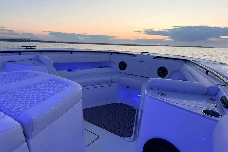 Slide: The Image of Luxurious 2027 Tidewater 330 CC Adventure boat interior at sunset on the water. - 8