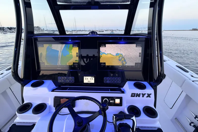 Slide: The Image of Cockpit of 2027 Tidewater 330 CC Adventure boat with dual navigation screens. - 23