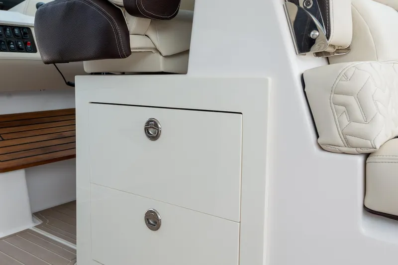 Slide: The Image of Manufacturer Provided Image: 2026 Regal LS36 boat interior with leather seating and storage drawers. - 16