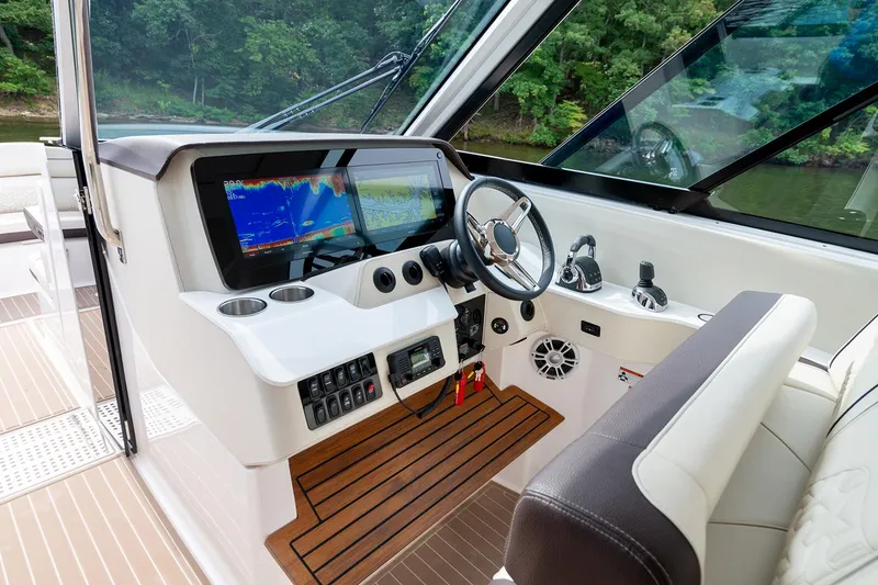 Slide: The Image of Manufacturer Provided Image: 2026 Regal LS36 boat cockpit with modern controls and navigation system. - 14
