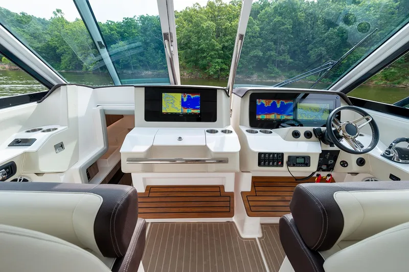 Slide: The Image of Manufacturer Provided Image: 2026 Regal LS36 boat cockpit with modern navigation displays and luxurious seating. - 13
