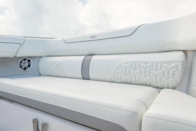 Slide: The Image of Manufacturer Provided Image: 2026 Regal LS36 boat interior with luxurious white seating and speaker detail. - 18