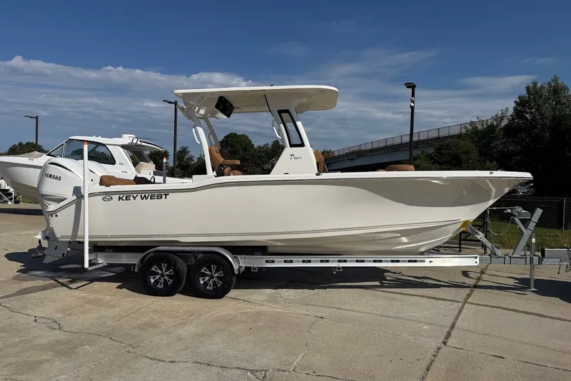 The Image of 2027 Key West 263 FS boat on trailer, sunny day, outdoor display. - 14