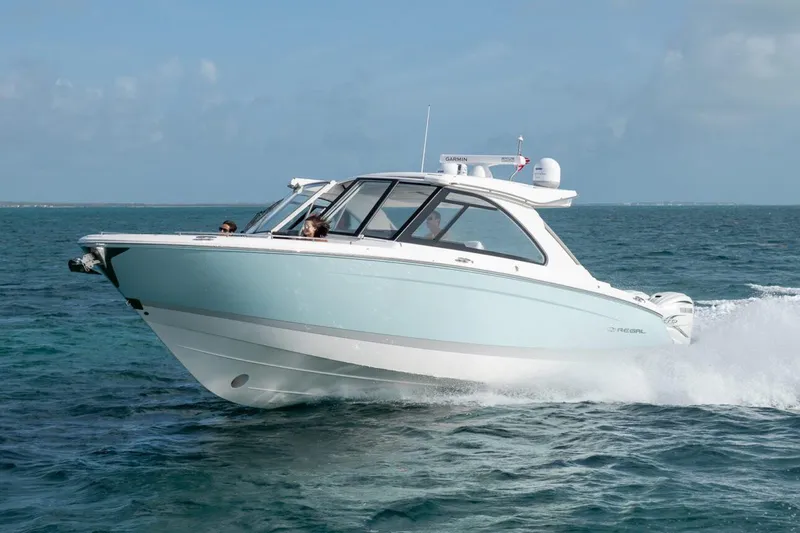 The Image of Manufacturer Provided Image: 2026 Regal LX36 boat cruising on open water. - 1