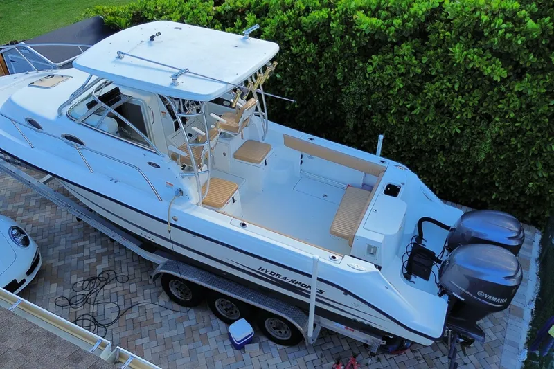 Slide: The Image of 2001 Hydra-Sports Vector 2800 WA boat on trailer, parked on brick driveway. - 47