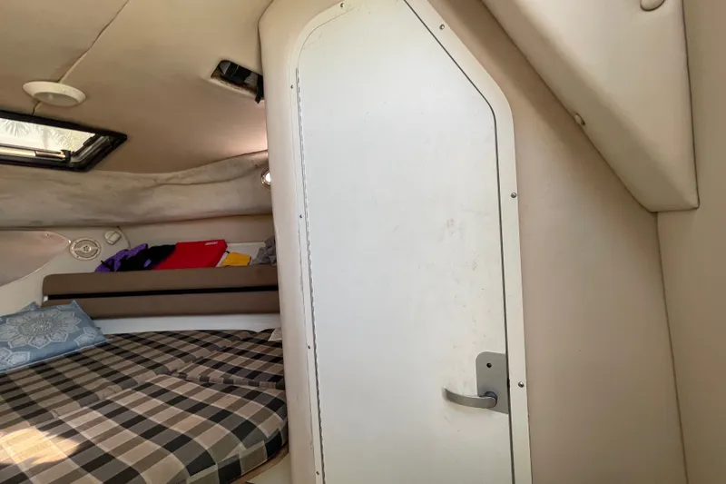 Slide: The Image of 2001 Hydra-Sports Vector 2800 WA cabin interior with bed and storage. - 39