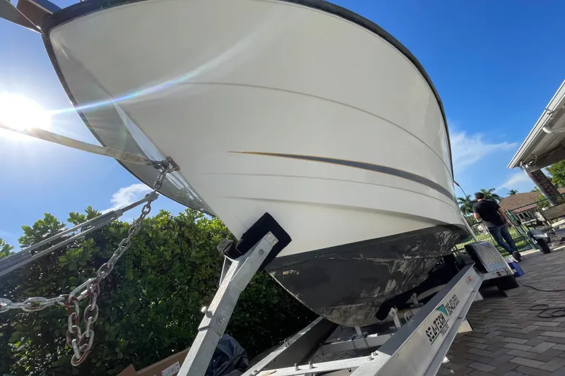 Slide: The Image of 2001 Hydra-Sports Vector 2800 WA boat on trailer under bright blue sky. - 15