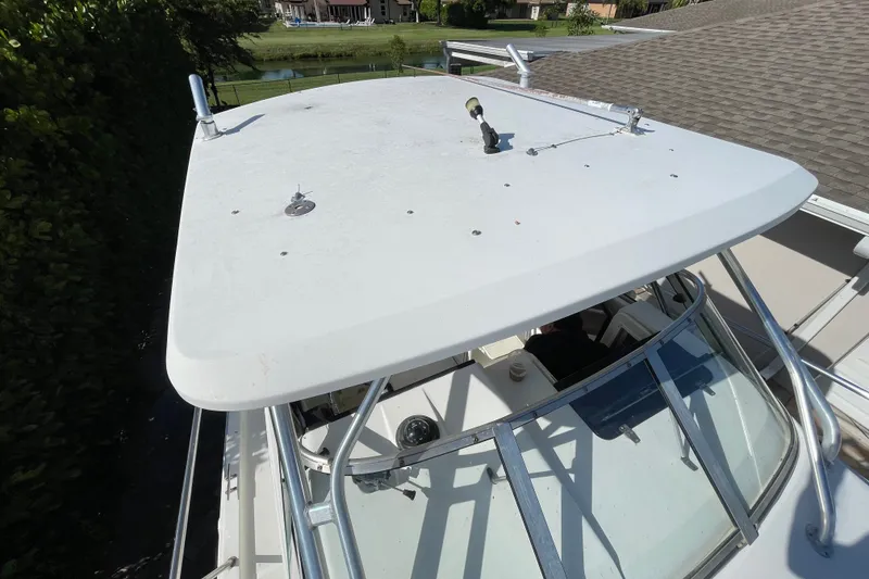 Slide: The Image of 2001 Hydra-Sports Vector 2800 WA boat with a white hardtop and windshield. - 28
