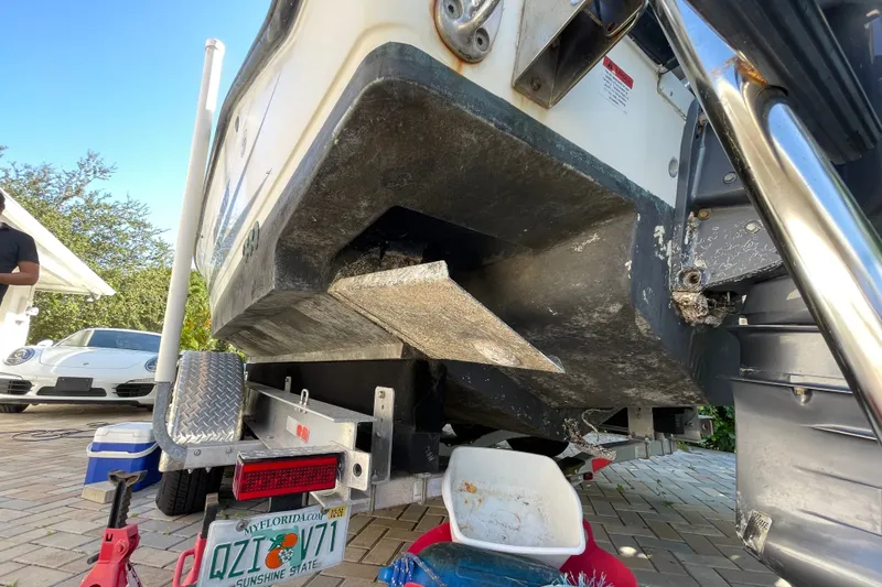 Slide: The Image of 2001 Hydra-Sports Vector 2800 WA boat on trailer, showing hull and license plate. - 42