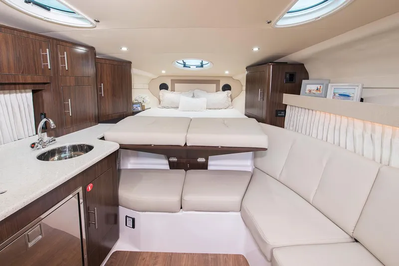 Slide: The Image of Manufacturer Provided Image: Luxurious interior of 2026 Regal 33 XO yacht with modern amenities and cozy seating. - 16