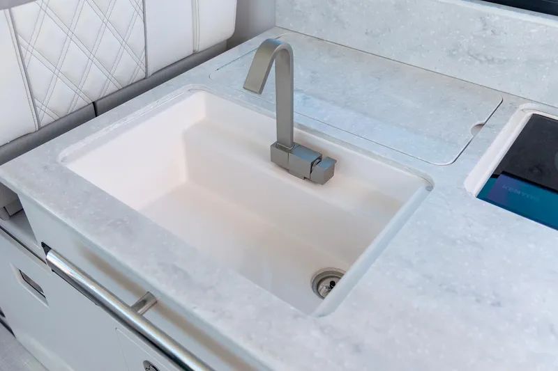 Slide: The Image of Manufacturer Provided Image: Modern sink in 2026 Regal 36 Grande Coupe yacht's sleek kitchen area. - 16