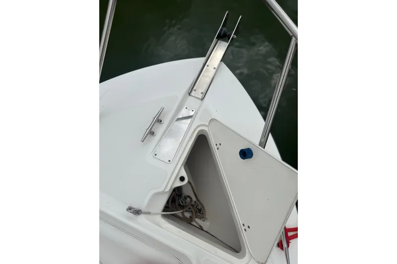 Slide: The Image of Bow storage compartment on a 2005 Boston Whaler 270 Outrage boat. - 21