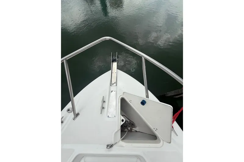 Slide: The Image of Bow of a 2005 Boston Whaler 270 Outrage with open anchor locker. - 22