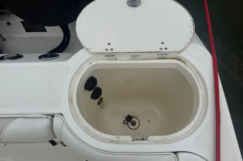 Slide: The Image of Open storage compartment on a 2005 Boston Whaler 270 Outrage boat. - 20