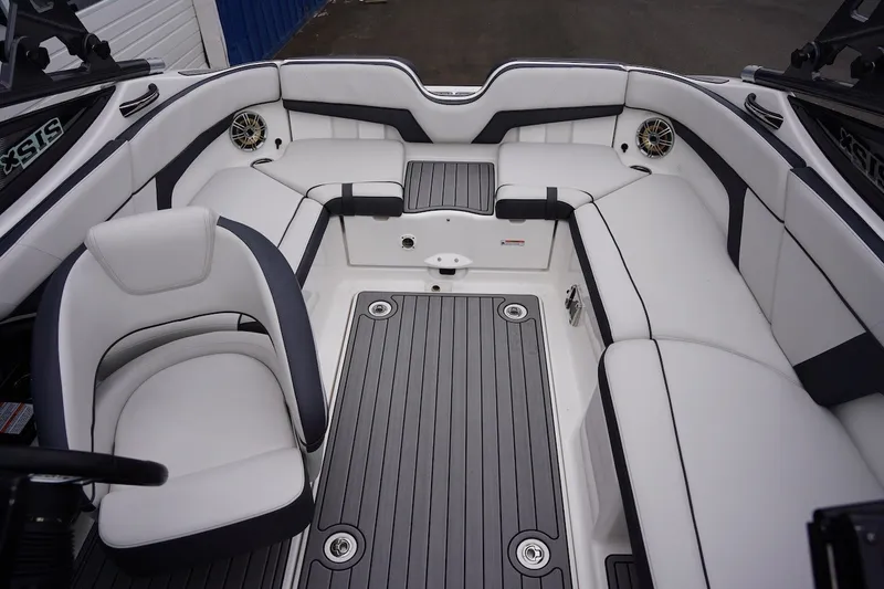 Slide: The Image of Interior of 2014 Yamaha Boats 212X, featuring sleek white seating and modern design. - 4