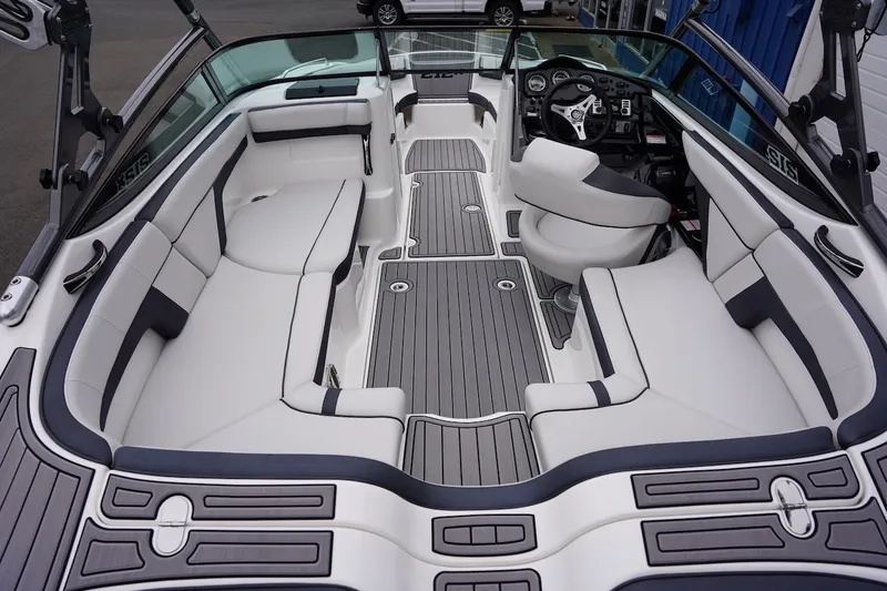 Slide: The Image of 2014 Yamaha Boats 212X interior with sleek seating and modern dashboard design. - 7