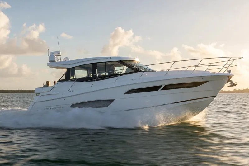 The Image of Manufacturer Provided Image: 2026 Regal 38 Grande Coupe cruising on water at sunset. - 0