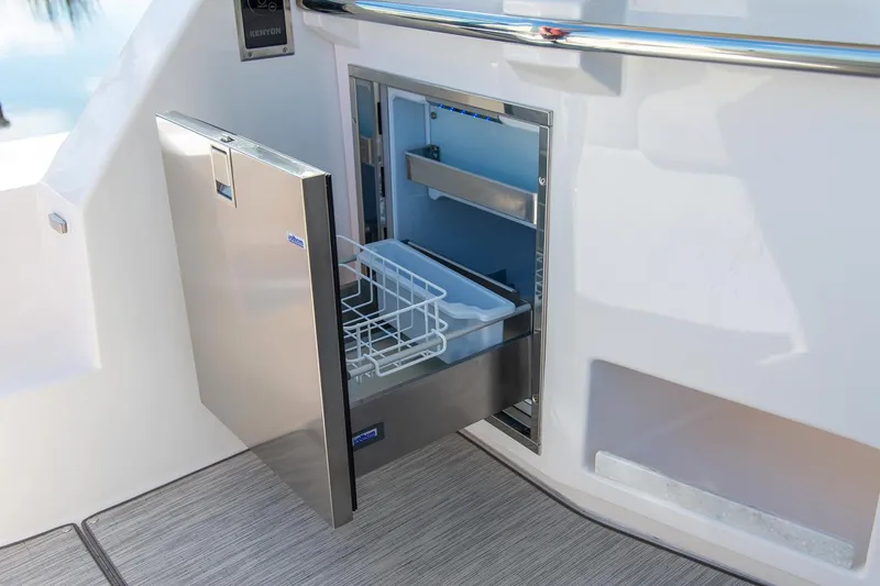 Slide: The Image of Manufacturer Provided Image: Open stainless steel refrigerator on 2026 Regal 38 Grande Coupe yacht deck. - 14