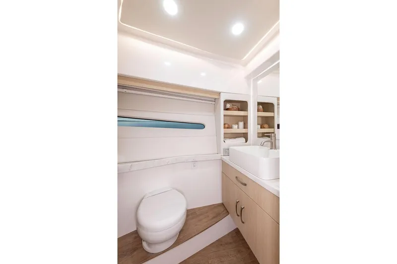Slide: The Image of Manufacturer Provided Image: Modern bathroom interior of 2026 Regal 38 Fly yacht, featuring sleek design and ample storage. - 20
