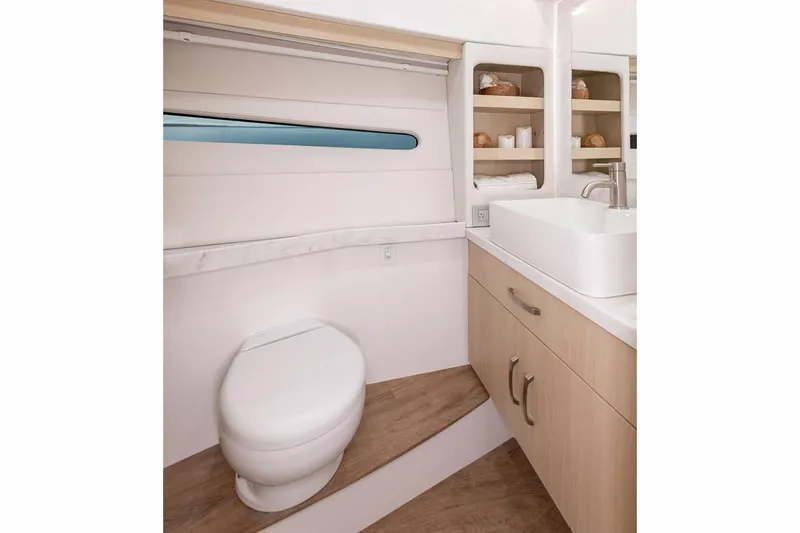 Slide: The Image of Manufacturer Provided Image: Modern bathroom interior of 2026 Regal 38 Fly yacht with sleek design and wooden accents. - 15