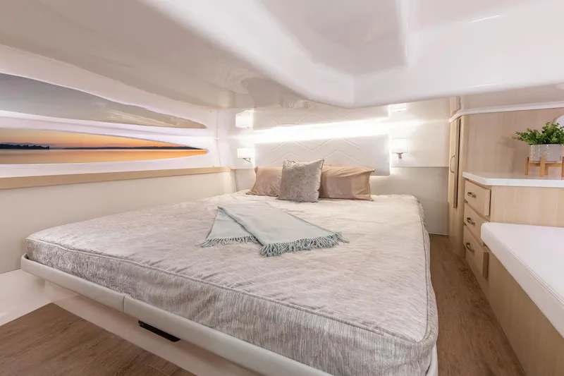 Slide: The Image of Manufacturer Provided Image: Luxurious cabin interior of 2026 Regal 38 Fly yacht with cozy bedding and modern decor. - 13