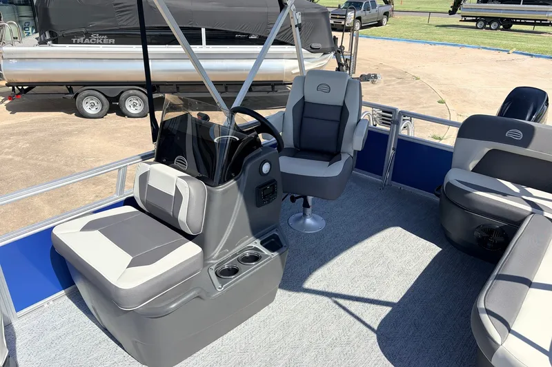 Slide: The Image of 2027 Sun Tracker Bass Buggy 16 XL Select interior with seating and steering console. - 15