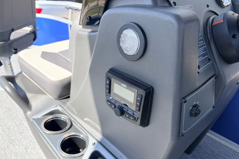 Slide: The Image of Control panel of 2027 Sun Tracker Bass Buggy 16 XL Select with cup holders. - 20