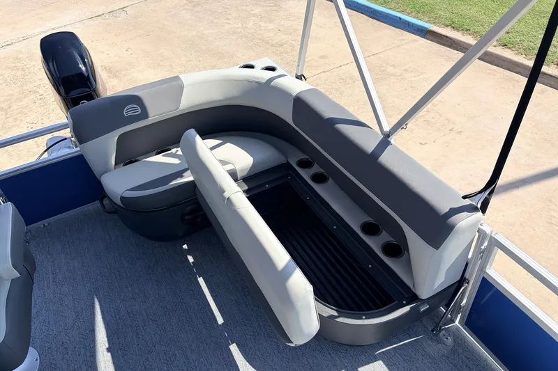 Slide: The Image of 2027 Sun Tracker Bass Buggy 16 XL Select boat interior seating with cup holders. - 22