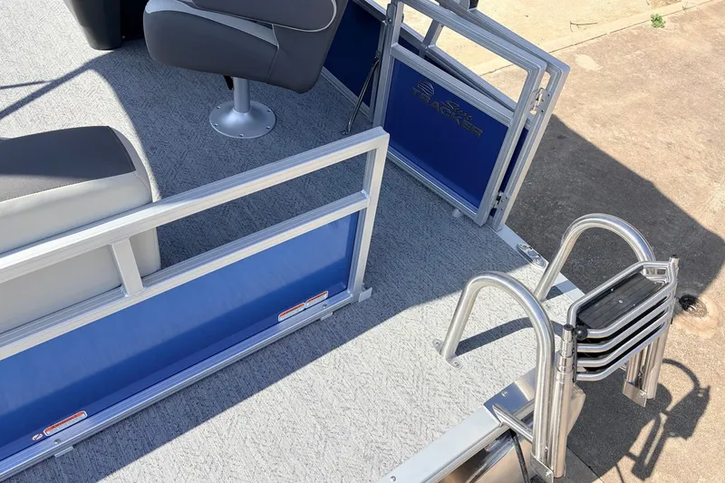 Slide: The Image of 2027 Sun Tracker Bass Buggy 16 XL Select pontoon boat interior with seating and ladder. - 27