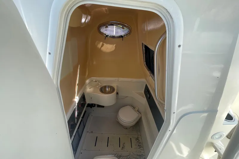 Slide: The Image of 2004 Hydra-Sports Vector 3300 CC boat interior with compact bathroom amenities. - 33