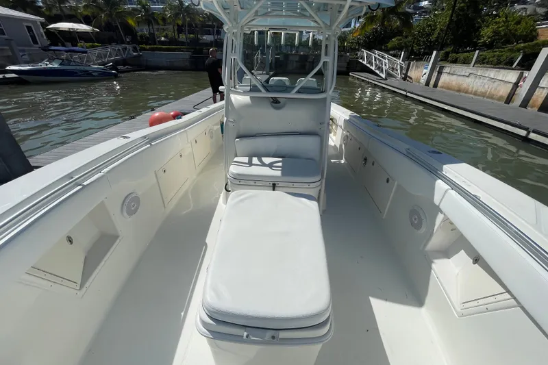 Slide: The Image of 2004 Hydra-Sports Vector 3300 CC boat interior with seating, docked at marina. - 29