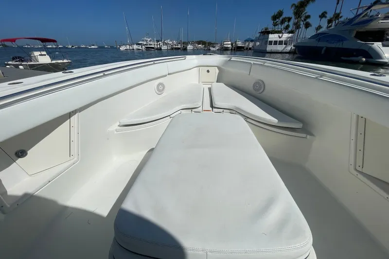 Slide: The Image of 2004 Hydra-Sports Vector 3300 CC boat interior with white seating, docked at marina. - 28