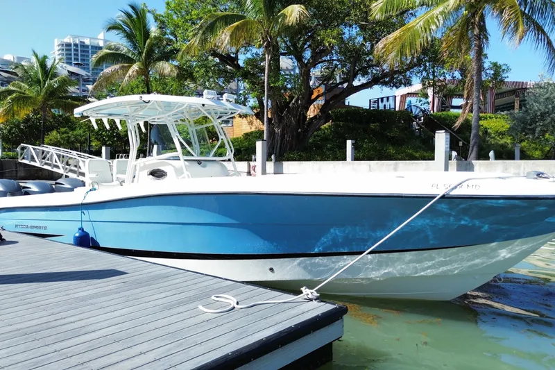 The Image of 2004 Hydra-Sports Vector 3300 CC boat docked by palm trees. - 0