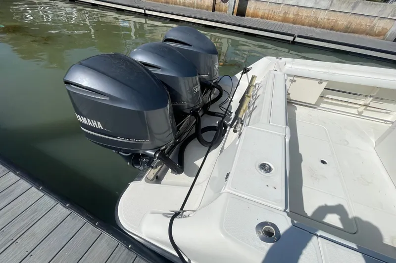 Slide: The Image of 2004 Hydra-Sports Vector 3300 CC with triple Yamaha outboard engines docked. - 35