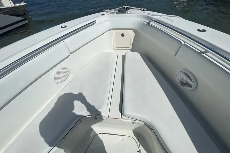 Slide: The Image of 2004 Hydra-Sports Vector 3300 CC boat interior with white seating and speakers. - 30