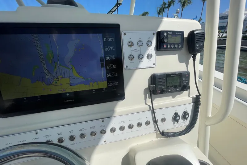 Slide: The Image of 2004 Hydra-Sports Vector 3300 CC dashboard with navigation and communication equipment. - 24
