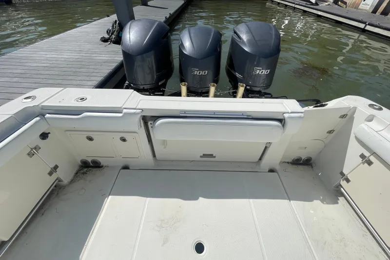 Slide: The Image of 2004 Hydra-Sports Vector 3300 CC boat with triple Yamaha 300 engines at dock. - 17