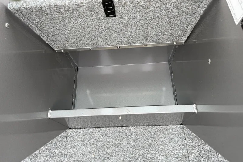 Slide: The Image of Storage compartment of 2026 Crestliner 1850 Commander boat, featuring durable interior design. - 11