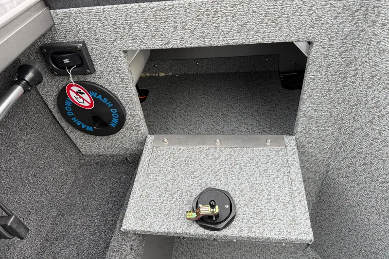 Slide: The Image of Interior of 2026 Crestliner 1850 Commander boat with washdown feature. - 13
