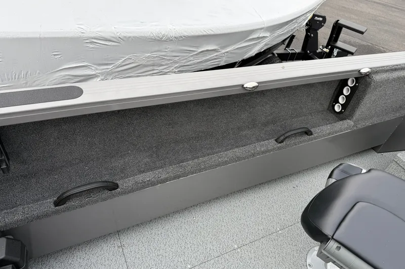 Slide: The Image of 2026 Crestliner 1850 Commander boat interior with seating and storage features. - 15