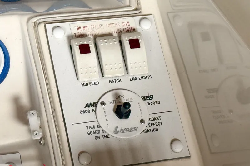 Slide: The Image of Control panel of a 2000 Sonic 45 SS boat with switches and GPS indicator. - 48