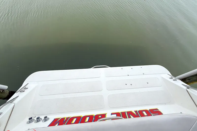 Slide: The Image of Rear view of a 2000 Sonic 45 SS boat platform above calm water. - 42