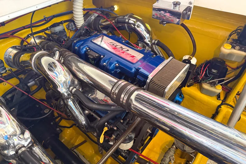 Slide: The Image of Engine compartment of a 2000 Sonic 45 SS boat with chrome components. - 33