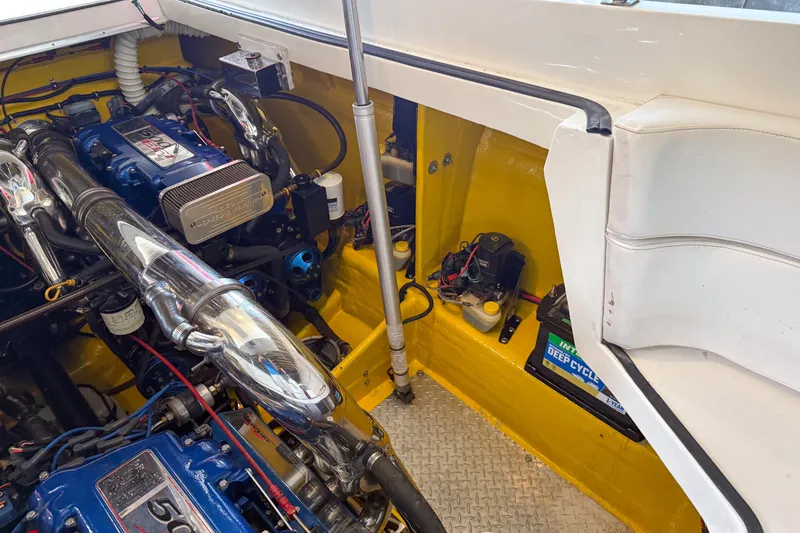 Slide: The Image of Engine compartment of a 2000 Sonic 45 SS boat, featuring a powerful engine setup. - 29