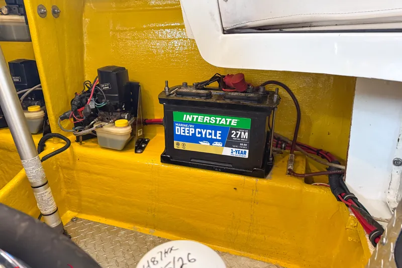 Slide: The Image of Battery compartment of a 2000 Sonic 45 SS boat with Interstate deep cycle battery. - 30