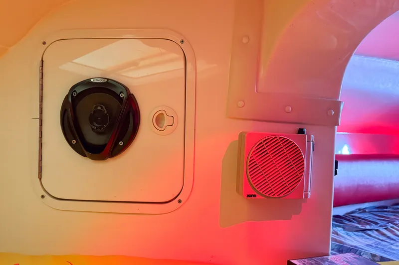 Slide: The Image of Interior of a 2000 Sonic 45 SS boat with Kenwood speaker and red lighting. - 20