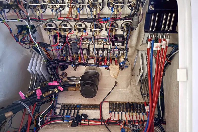 Slide: The Image of Electrical wiring and components inside a 2000 Sonic 45 SS boat. - 15