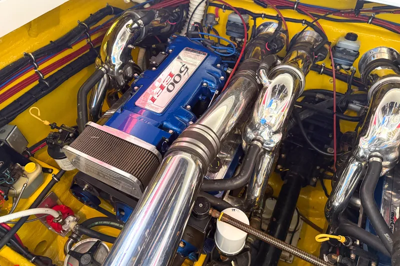 Slide: The Image of Engine of a 2000 Sonic 45 SS boat with chrome components and vibrant wiring. - 34