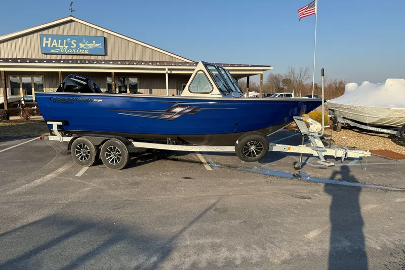 Slide: The Image of 2026 Crestliner 2050 Commander boat on trailer at Hall's Marine dealership. - 1